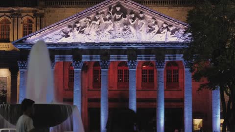 Neoclassical building illuminated at night