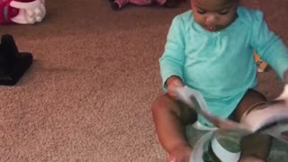 1 year old cutie determined to read!