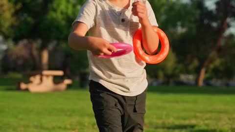 A Child Playing with Toys at the Park