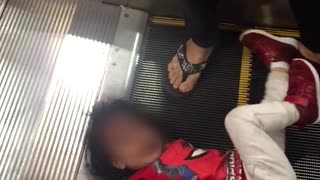 Little Girl Trapped in Escalator