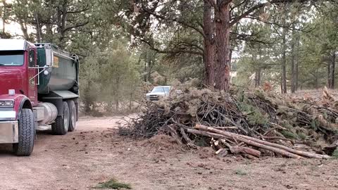 Dump Truck bring Rock in from the view of my Polaris