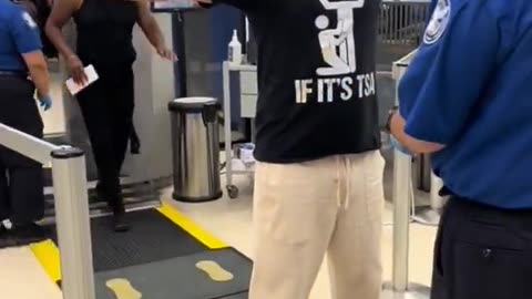 Mans shirt at airport LOLOL