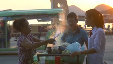 Vietnamese Street Vendor Serving Food