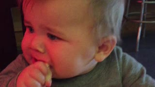 Teething baby gets a little help from Granny