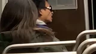 Man flicks his tongue up and down on bus