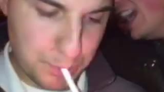 Girl tries to get in video with friend while friend is smoking and burns herself