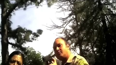 Paranoid cop points his weapon at a private investigator while shaking and refusing to back down.