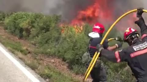 Firefighters battle raging wildfires in Spain