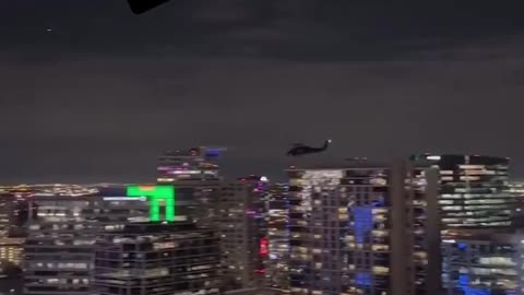 Military helicopters flying throughout Dallas tonight, caught on video. Training or not?