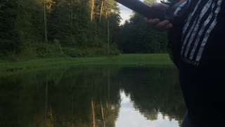 Man Catches Fish with A Banjo