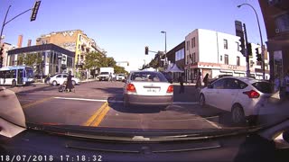 Idiot with zero awareness makes illegal left in front of cop