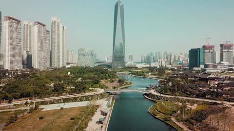 A Modern Building Towering In The Center Of A City