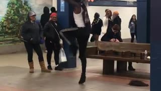 Man black outfit boots dancing subway station