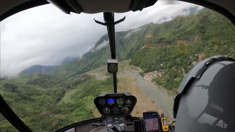 Low Ceiling Heli Flight to Remote Village