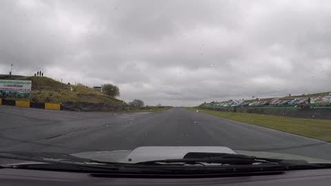 Subaru Impreza Turbo at Knockhill Racetrack in Scotland with rain Wet track