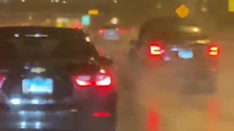 Car Speeds Down the Expressway with its Hood Up
