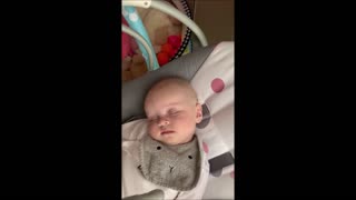 Sleeping baby in funny position