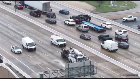 "Frozen Chaos: Drone Footage of Houston's Icy Bridge Escapades"