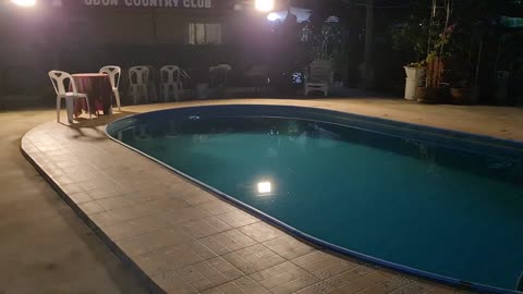 300-watt solar spotlight set up to light up a swimming pool. Warm white