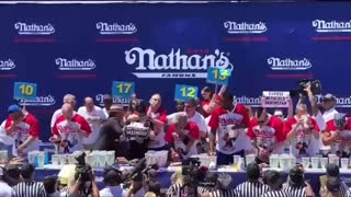 Joey Chestnut slams down a protester at a hot dog eating contest