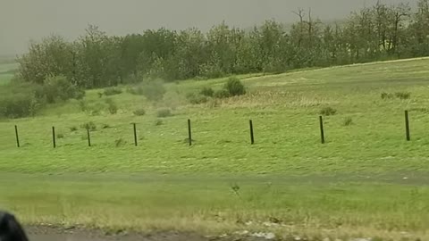 The Aftermath of a Heavy Hailstorm Filmed From a Passing Vehicle