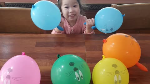 Little girl playing hide and seek at Birthday party.