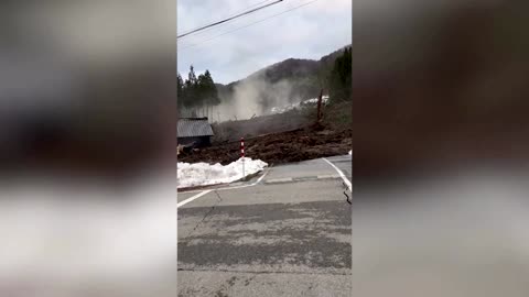 Residents escape a landslide following Japan quake