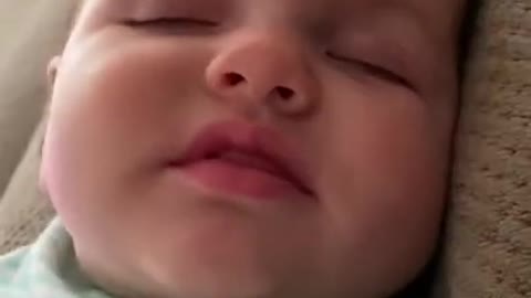 Cute Baby saying Mama while sleeping.