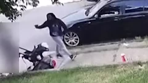 A horrifying video shows an armed woman shooting a seven-month-old infant