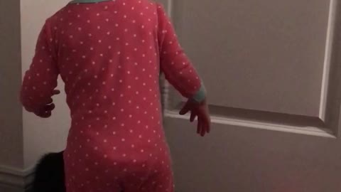 Cat Helps Baby Girl Open Door After She Repeatedly Fails