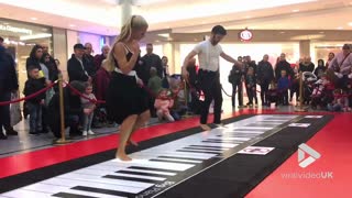 Couple Perform A Beethoven Classic On Giant Floor Piano