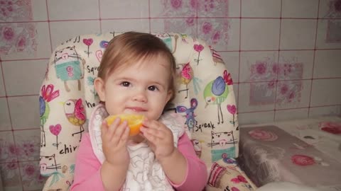 Cute_Baby's_Reaction_to_an_Orange