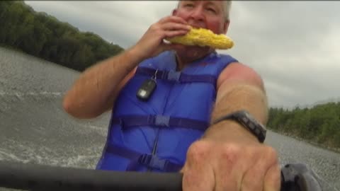 Man Eats Corn On The Cob While Riding A Water Ski