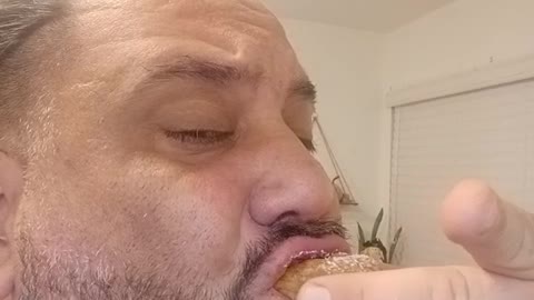 Guy eating fried oreos