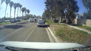 Car Flips After Hitting Parked Vehicle