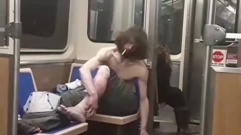 Shirtless homeless man on the train