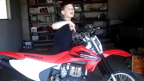 Kid Gets Dirt Bike For His Birthday And Can't Stop Jumping For Joy