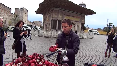 Squeezing fresh pomegranate juice in Istanbul, Turkey