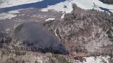 Train carrying potentially hazardous materials derailed and caught fire near Rockwood, Maine