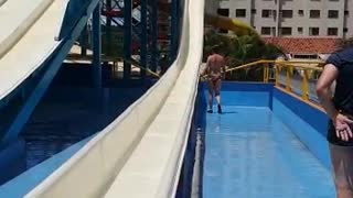 Grandmother Climbs into Water Slide and Gets Hit