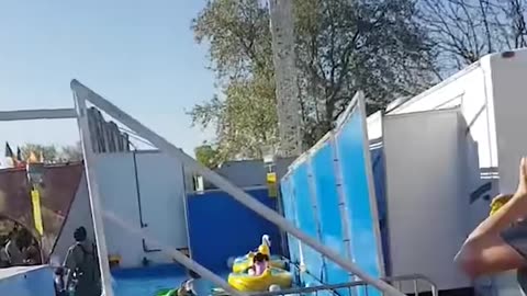 Woman Falls from Ride and Dangles by Feet