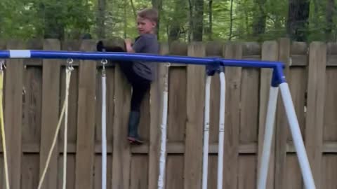 Kid Gets Stuck Trying to Climb Fence