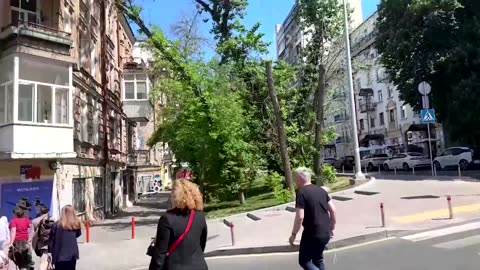People rush for cover as explosions heard in Kyiv