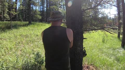 2 guys camping with guns