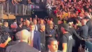 The UFC crowd erupts when Kid Rock, Tucker Carlson, and Donald Trump arrive ringside