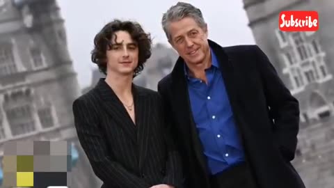 Hugh Grant Learns About Timothée Chalamet's 'Timmy Tim' Rap Origins (Exclusive)