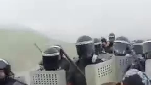 Azerbaijani grandmas vs riot cops in some field