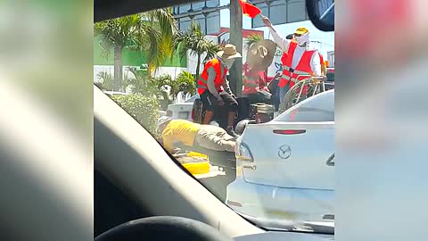 Construction Workers Paint Curb