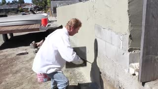 White cement over block retaining walls.