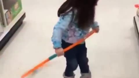 Little girl playing hula hoop